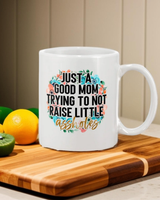 Just A Good Mom trying to Not Raise Little Assholes coffee mug 15 ounces