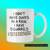I don't have ducks in a row I have squirrels & they're everywhere coffee mug 15 ounces
