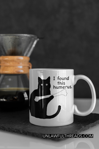 I found this humerus mug or shirt available 15 oz.  Humerus cat