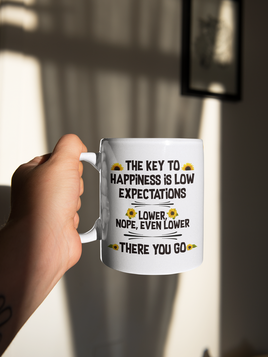 The key to happiness is low expectations coffee mug 15 ounce